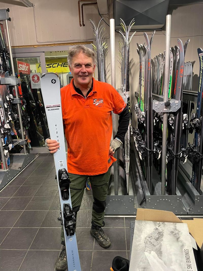 A Trysil Skishop employee with freshly prepared alpine skis in the rental store room